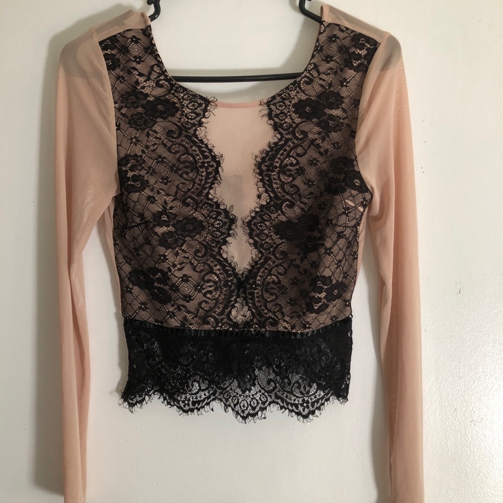 Nude and black top